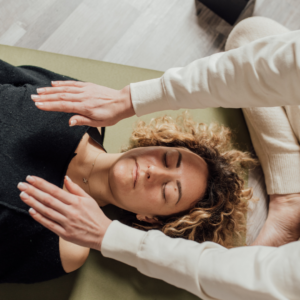 Reiki practitioner providing a relaxing Reiki session for nervous system regulation in Chicago.